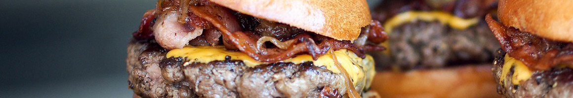 Eating Burger Sandwich at MrPickle's Sandwich & Burger Shop restaurant in Carmichael, CA.